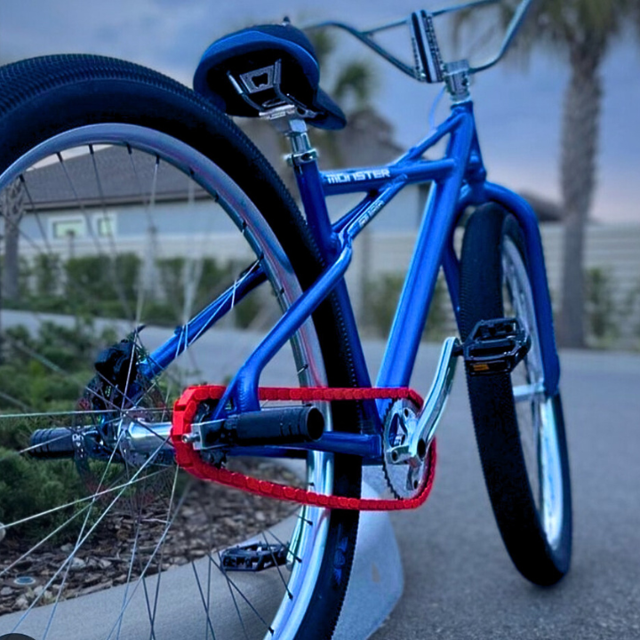 BMX Bikes Red featuring a vibrant blue frame and eye-catching red snap-on chain caps, perfect for stylish rides.