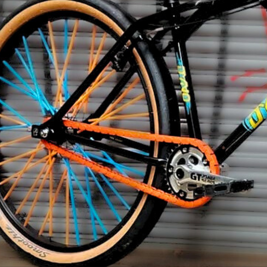 BMX Bikes with Pegs showcasing orange snap-on chain caps and colorful wheels for unique customization.