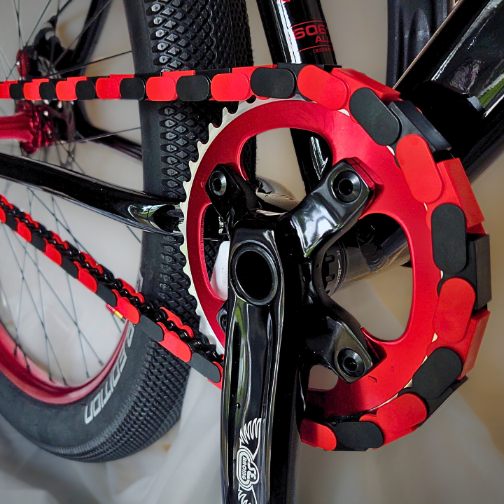 Big Wheelie custom chain featuring black and red two tone Insane Chains on a BMX bike.