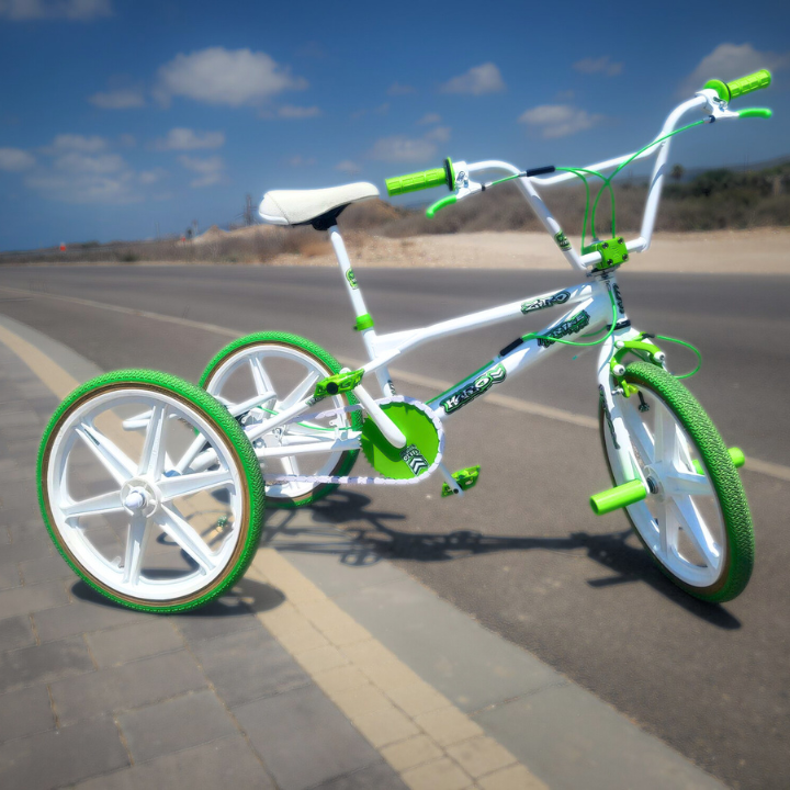 BMX Bikes Best Brands - White snap-on chain caps on a stylish green and white BMX bike on the road.