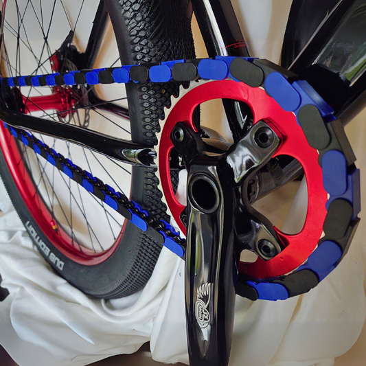Custom BMX Parts featuring black and blue two tone chains and a bold red crankset.