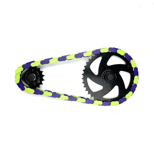 Fixie Bikes Parts – Bright Green & Purple Two Tone Insane Chains showcasing a unique chain design.