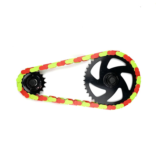Fixie Bikes Parts featuring a Red & Bright Green Two Tone snap-on chain on a black sprocket.