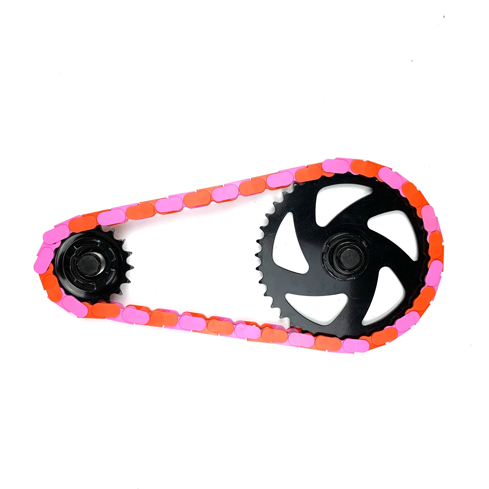 Bike Chain Guard Cover – Pink & Orange Two Tone Insane Chains on a bicycle chain with gears.