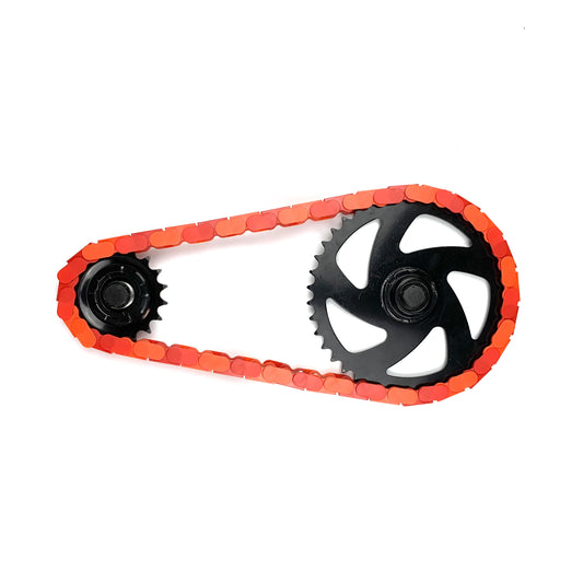 Custom Bike Chain in red and orange two tone with black sprockets, creating a bold cycling accessory.