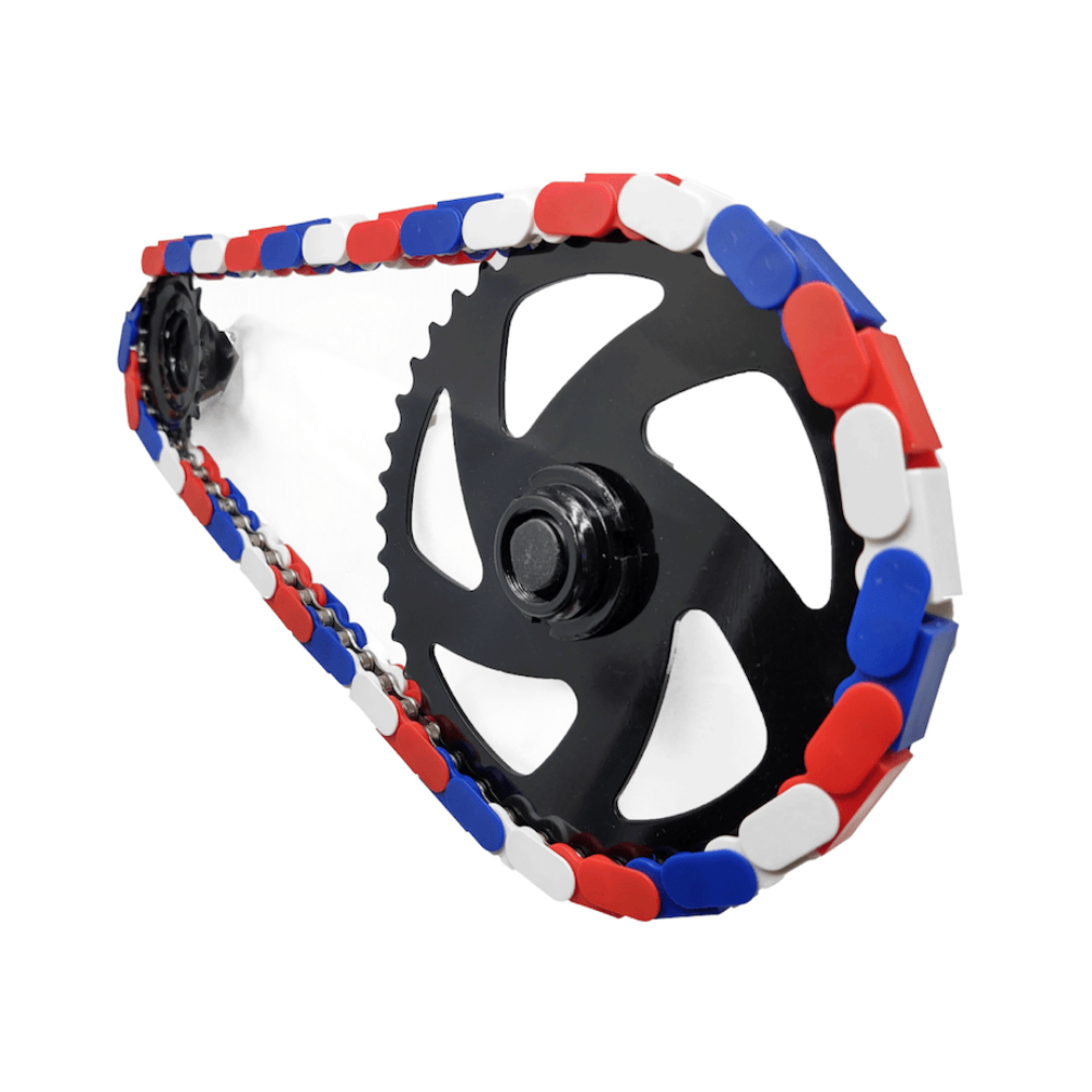 American Red White & Blue Tri Tone Snap-On Chain Caps on a bike chain with black sprocket