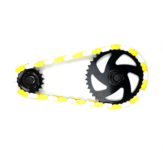 Bike Chain Accessories featuring a black gear with white and yellow two-tone snap-on caps.
