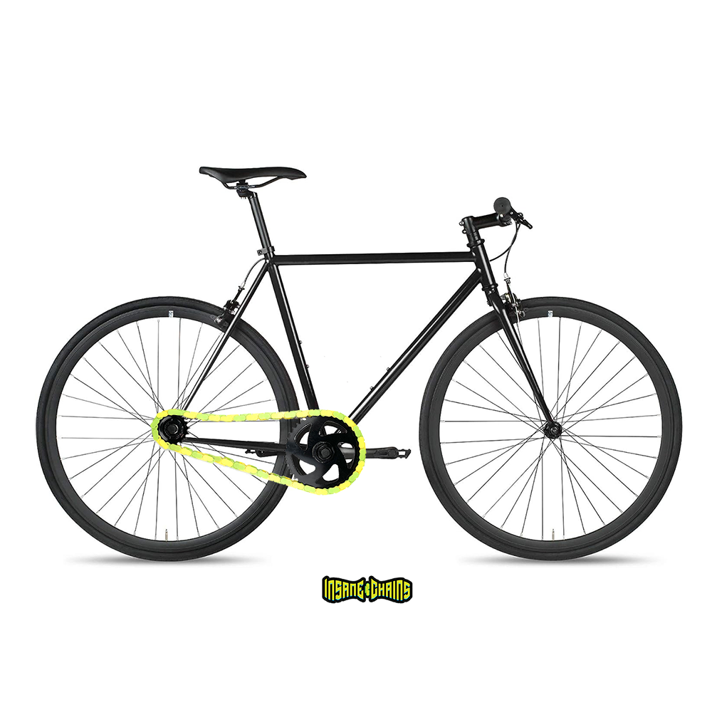 Colored Bike Chain in yellow and bright green on a sleek black bike showcasing vibrant two-tone design.