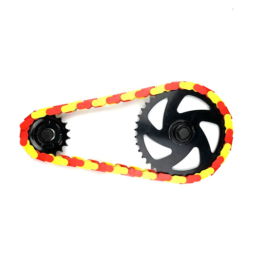 Single Speed Bike Chain in red and yellow two tone with black gears, showcasing a unique and bold design.