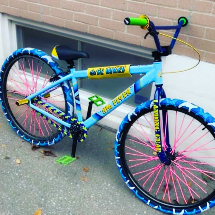 Single Speed Bike Chain in blue and bright green tones showcasing a vibrant bike with unique neon accents.