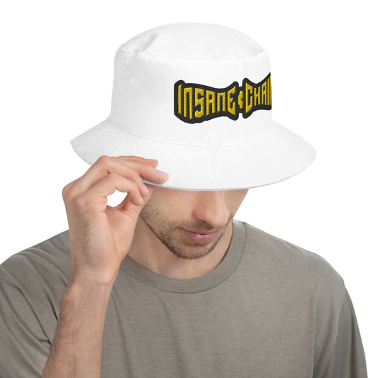 Man wearing a white Insane Chains bucket hat, showcasing style and comfort.