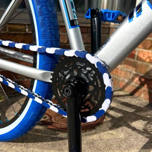 Customizable BMX Bikes featuring Blue & White Two Tone caps on the chain and sleek frame.