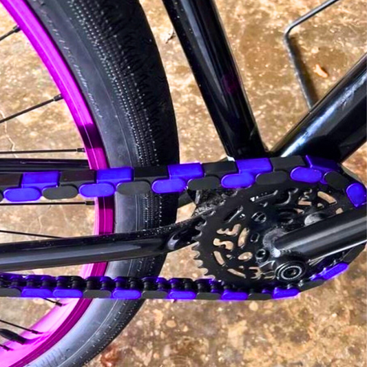 S E Bike with black and purple two-tone Insane Chains showing the chain and gears.