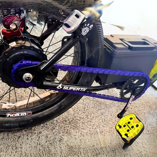 BMX Bikes Used with purple snap-on chain caps, showcasing a close-up of the bike's chain and pedals.
