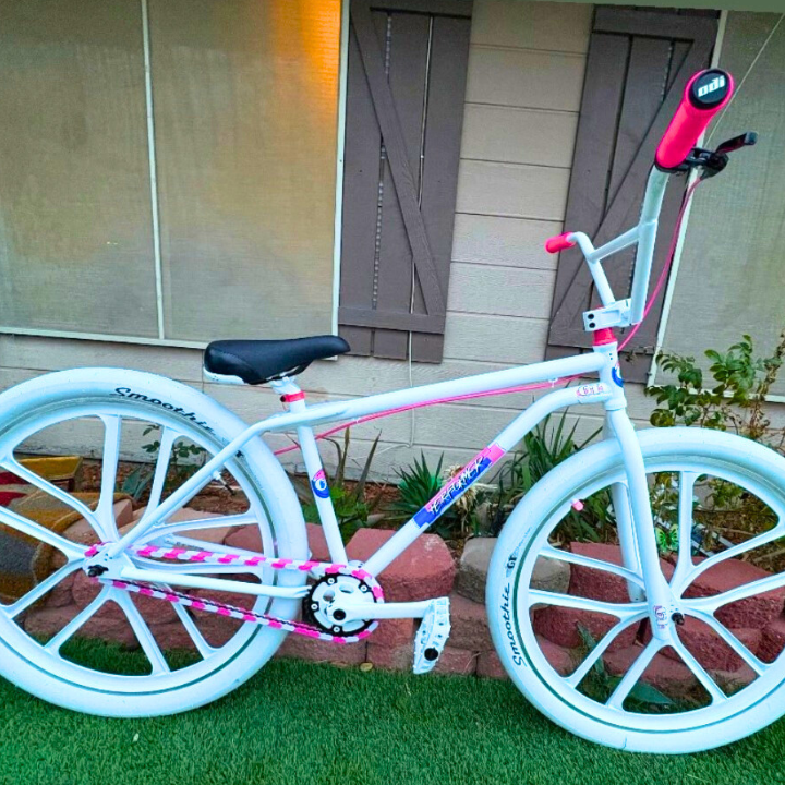 BMX Bikes Pink with white frame and pink accents, showcasing stylish design and Insane Chains detail.