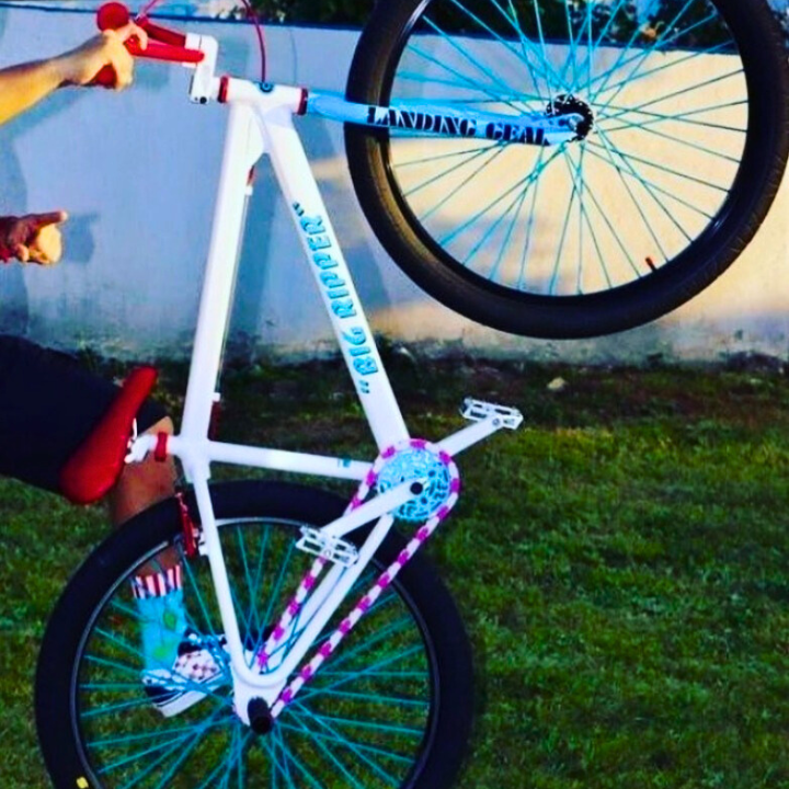 BMX Bikes Pink performing a trick with vibrant white and pink design, showcasing Insane Chains two tone style.