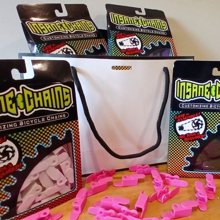 Bike Gifts Under $40 - Snap-On Chain Caps in pink and other colors by Insane Chains.