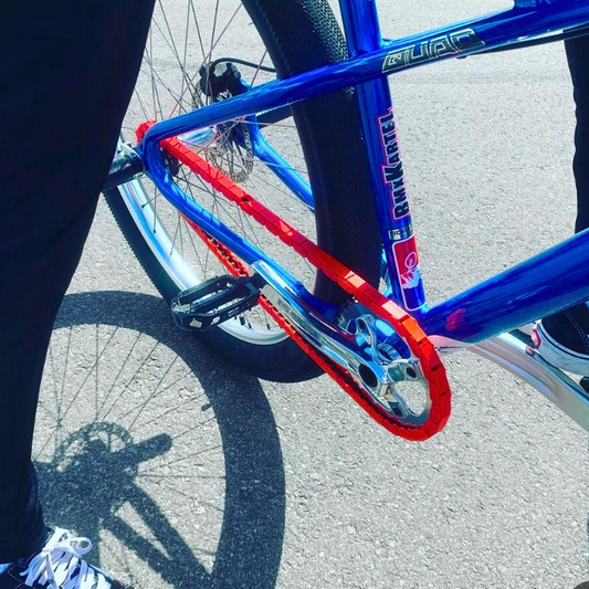 BMX Bikes Red featuring bold red snap-on chain caps enhancing the bike's vibrant look while riding.