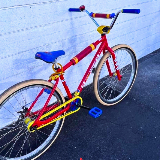 Customizable BMX Bikes with vibrant yellow, red, and blue colors, showcasing snap-on chain caps in a stylish setup.