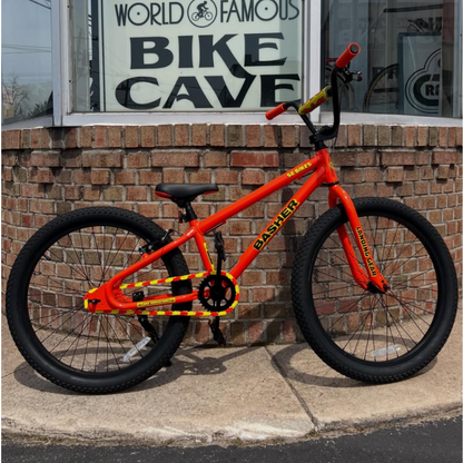 Bike Chain Cover on vibrant orange BMX bike with bold yellow details, showcasing a striking two-tone design.