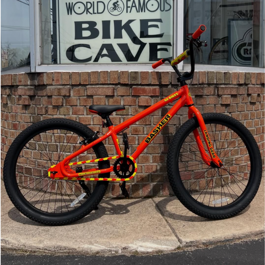 Bike Chain Cover on vibrant orange BMX bike with bold yellow details, showcasing a striking two-tone design.