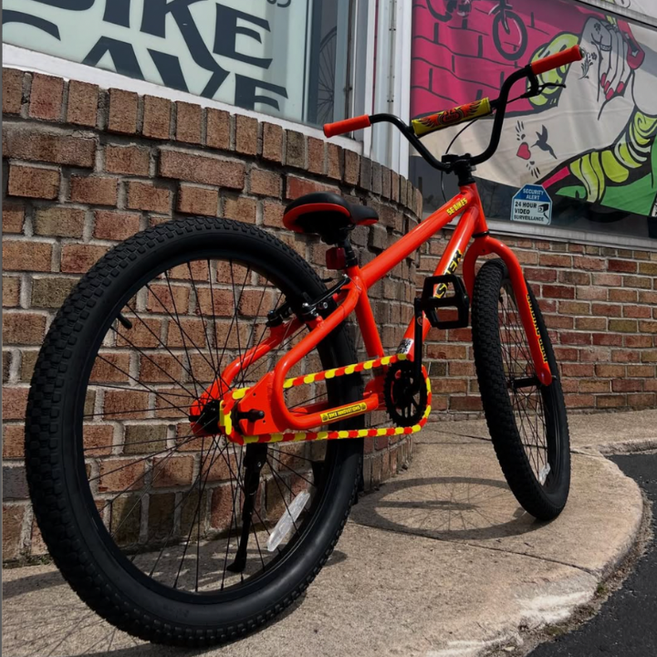 Bike Chain Cover on a bright orange BMX bike emphasizing yellow and orange colors for a bold look.