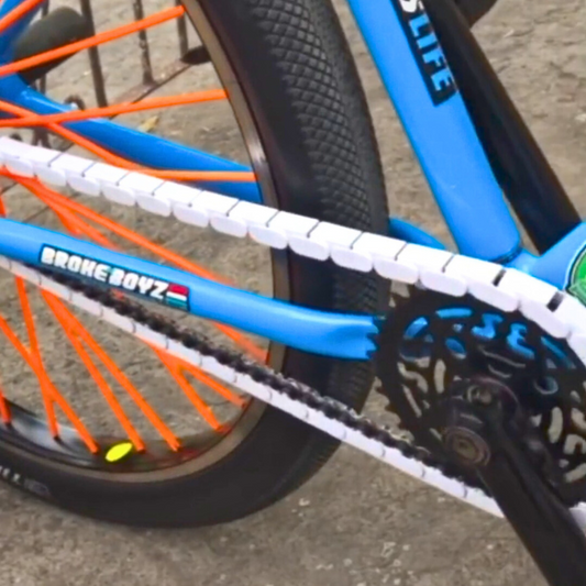 BMX Bikes Best Brands with white snap-on chain caps on a blue bike showcasing style and protection for the chain.