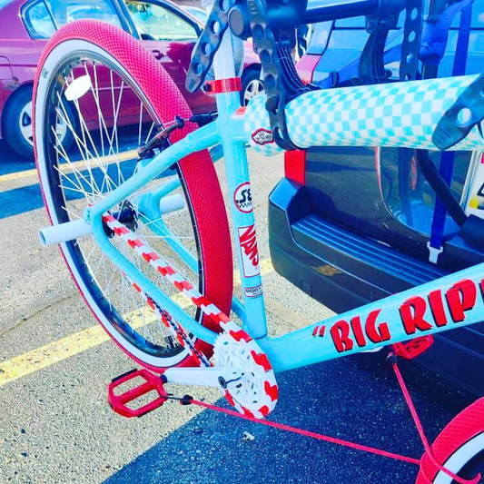 BMX Bikes Red with distinctive white and red two-tone design showcasing Insane Chains and unique tires.