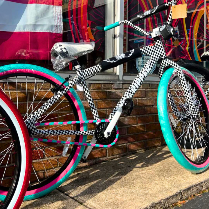 Bike Gifts for Girls - colorful checked bike with teal and pink accents, showcasing fun design features.