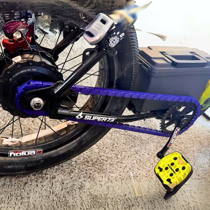BMX Bikes Used with purple snap-on chain caps, showcasing a close-up of the bike's chain and pedals.