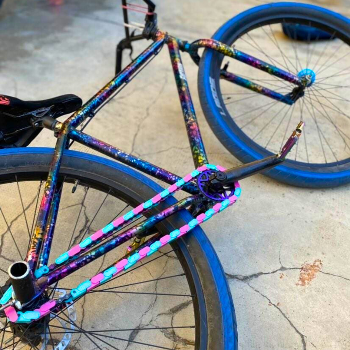 Bike Gifts for Girls - colorful two tone bike with teal and pink Insane Chains caps.